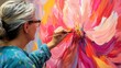 © Penatic Studio - A Female Artist Painting a Colorful Abstract Flower on Canvas