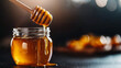 © Nii_Anna - Honey dipper with honey jar on dark rustic background