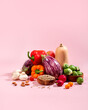 © Maria Shchipakina - Vegan background with fresh seasonal autumn vegetables, vegan fall still life on pink