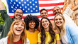 © Davide Angelini - Multiracial American people holding United States flag - Diverse citizen celebrating USA National Election Day