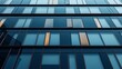© primopiano - Close-up of a modern glass building facade with reflective windows and geometric patterns