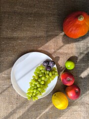 variety of fresh fruits laid out on a wooden table. High quality photos