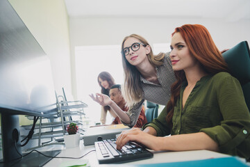 Photo of happy smiling students enjoying business school studying looking modern device indoors workplace workstation