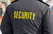 © Cerib - Embroidered word Security on the back of a uniform jacket