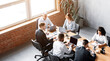 © Prostock-studio - Teamwork. Diverse Business People Working Together Sitting At One Desk In Spacious Modern Office. High Angle Shot, Copy Space