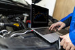 © zphoto83 - Mechanic using a laptop to diagnose issues under the hood of a vehicle in a garage during daylight hours