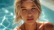 © tiagozr - Young woman with striking gaze in a sunlit pool.