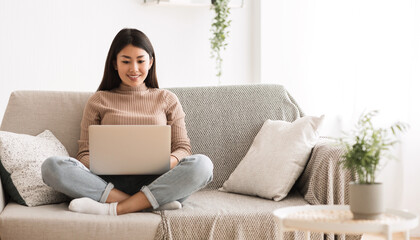 Wall Mural - Recruitment Concept. Girl Browsing Work Opportunities Online, Using Job Search App or Website on Laptop, Copy Space