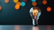 © khonkangrua - Innovative Light Bulb with Colorful Bokeh Background