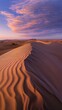 © Shozib - Sand dunes stretching under a colorful sunset sky in the desert
