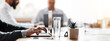 © Prostock-studio - Corporate Lifestyle. Unrecognizable Businessman Working On Laptop During Business Meeting Sitting At Desk In Office. Cropped, Selective Focus, Panorama