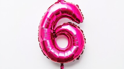 Pink foil balloon shaped like the number six isolated on a white background