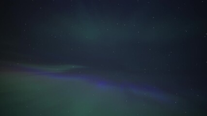 Wall Mural - Overhead Aurora Borealis exploding in many colors on a night sky. Timelapse
