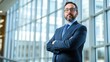 © TopMedia - Professional Executive Posing in a Modern Office Space