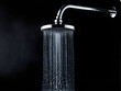 © Nyetock - Drop of water coming out of a shower on the black background,Shower working water fly in the air