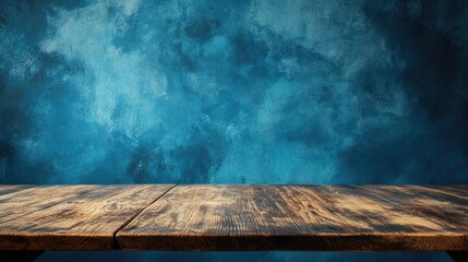 Poster - Wooden table against a blue gradient backdrop featuring ample copy space High quality image