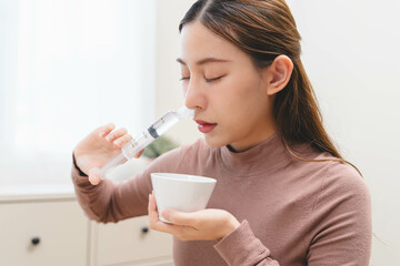 Close-up shot of woman cleaning her nasal.