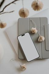 Wall Mural - Stylish desk setup with smartphone, tablet, decorative vase. Neutral colors and paper lanterns. Aesthetic and elegant minimal workspace