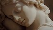 © Aris Suwanmalee - A serene close-up view of a marble statue depicting a peaceful sleeping figure, showcasing intricate details and soft textures.