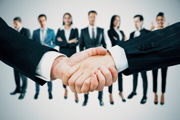 Aufkleber - Attractive caucasian businesspeople, handshake, success and partnership concept on light background.