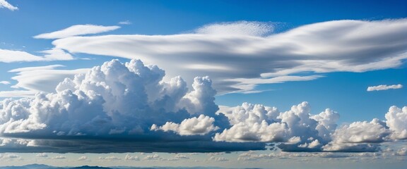 Canvas Print - vibrant summer sky with fluffy white clouds and blue horizon