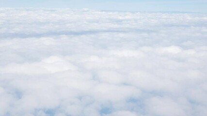 Wall Mural - Aerial view above the clouds and sky inspiration concept in cinematic breathtaking aerial flying over white fluffy cloudscape in high altitude sky with fresh clean air and blue skies on background.