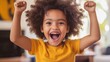 © Postmodern Studio - Young girl with curly hair is smiling and holding her arms up in the air
