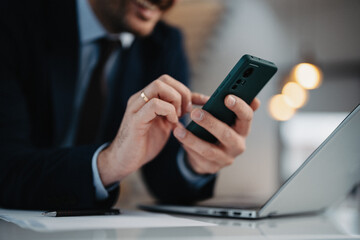 Close up images businessman using smartphone