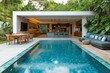 © TesaI - Modern open plan tropical house with infinity pool overlooking lush greenery