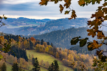 Wall Mural - Beautiful hilly landscape with forests, meadows and fields in autumn colors