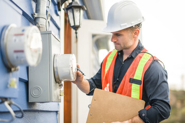 Wall Mural - man with hard hat standing in front of a electric panel