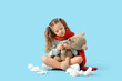 © Pixel-Shot - Sick little girl with spray for sore throat and toy bear sitting on blue background