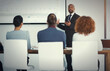 © peopleimages.com - Man, people and presentation in office for finance, annual report and pitch for investment opportunity. Male presenter, investors and chart in boardroom for growth projection, timeline and profit