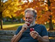 © Derek Brumby - Elderly Man Enjoying Fresh Apples in Autumn Park