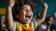 © JoxyAimages - A young child joyfully raises fists in the air in celebration, seated among friends in a classroom, capturing a moment of triumph and shared happiness.