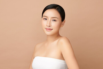 Beautiful young asian woman with clean fresh skin on beige background, Face care, Facial treatment, Cosmetology, beauty and spa, Asian women portrait.