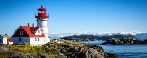 A picturesque lighthouse by the sea, surrounded by rocky shores and mountains, showcasing a clear blue sky and vibrant colors.