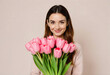 © DariaTrofimova - Portrait of a young girl with a bouquet of tulips