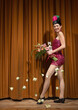 © Designpics - Woman on Stage Holding Flowers