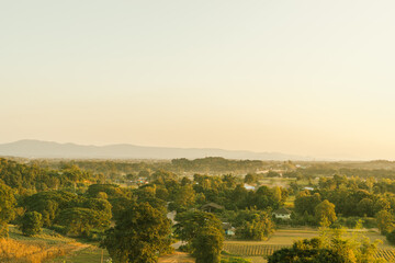 Wall Mural - Beautiful sunset at mountain hill layer