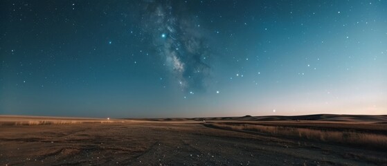 Wall Mural - The night sky painted with countless stars and a luminous Milky Way, arches over a barren, expansive landscape, evoking a sense of wonder and infinity.