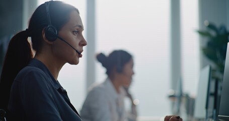 call center office: portrait of caucasian female technical customer support operator working on comp