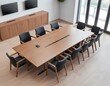 © ElseThen - Modern conference room with a large wooden table and black chairs in a bright office