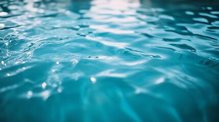 Leinwandbilder - Light blue swimming pool water with delicate ripples and shimmering reflections, conveying a sense of relaxation and calm.