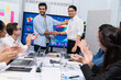 © InfiniteFlow - Analyst team leader shake hand with his colleague after successful data analysis meeting using FIntech software power with business intelligence or BI dashboard. Prudent