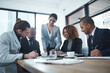 © peopleimages.com - Business, people and happy at office with explaining for project results, report and feedback as market research analyst. Corporate, employees and meeting with discussion, insight and updates