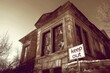 © Konstiantyn Zapylaie - Eerie abandoned house with broken windows and keep out sign in sepia tone