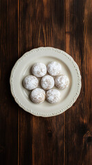 Wall Mural - Seven mouthwatering snowball cookies displayed on a rustic wooden table