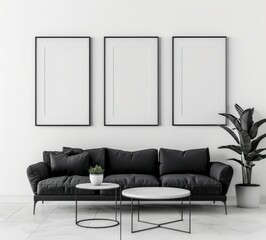 Minimalist living room interior design with black sofa. two coffee tables. and three empty picture frames