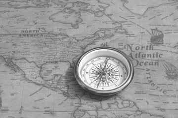 Wall Mural - classic round compass on background of old vintage map of world